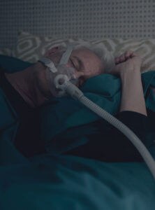 resmed-sleep-apnoea-patient-sleeping-CPAP-mask-device
