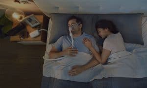 resmed-sleep-apnoea-patient-sleeping-CPAP-mask-machine